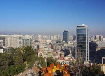 Panoramic view of buildings against blue sky