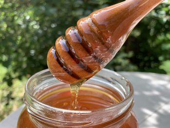 Close-up of glass honey on table