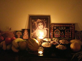 Candle lit candle in dark room