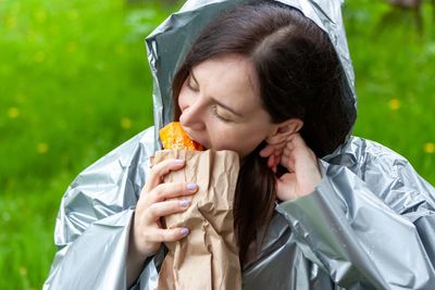 Portrait of woman eating food