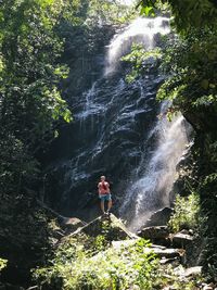 Tourist at waterfall