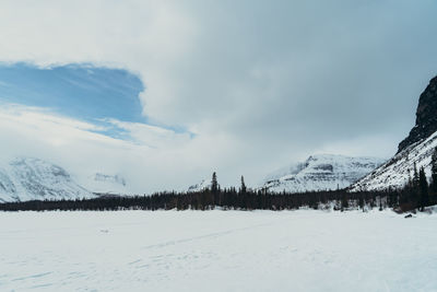 Scenic view of snow covered mountains against sky