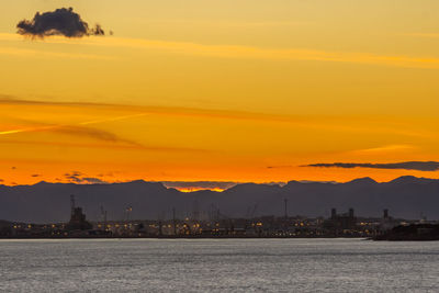 Scenic view of sea against orange sky