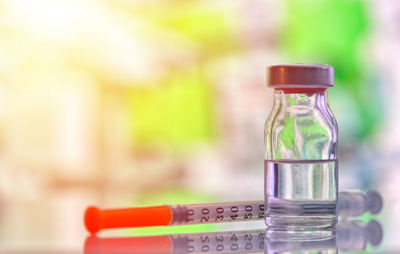 Close-up of glass bottle on table