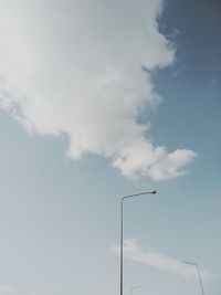 Low angle view of street light against sky