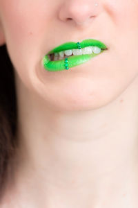 Cropped image of woman with green lipstick