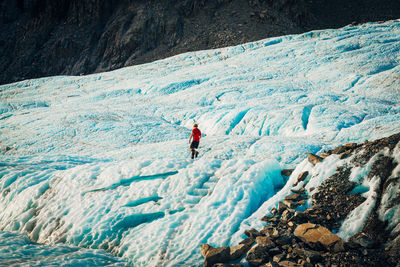 People skiing on snow covered mountain