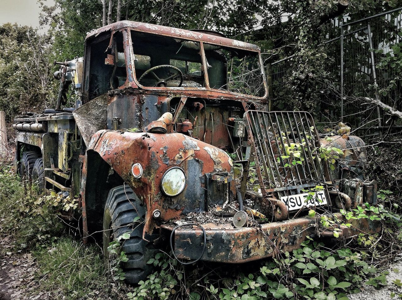 abandoned, obsolete, rusty, run-down, deterioration, old, damaged, metal, weathered, bad condition, transportation, tree, mode of transport, machinery, old-fashioned, field, metallic, day, outdoors, land vehicle