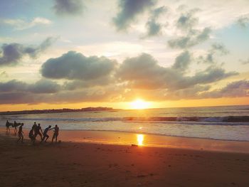 Scenic view of beach at sunset