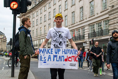 People standing on street in city