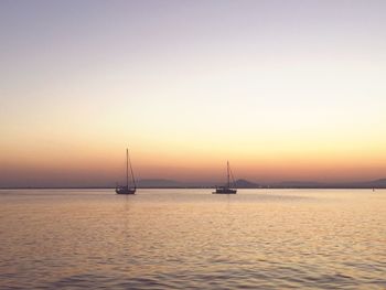 Scenic view of sea against clear sky during sunset