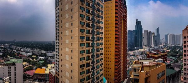 High angle view of buildings in city against sky