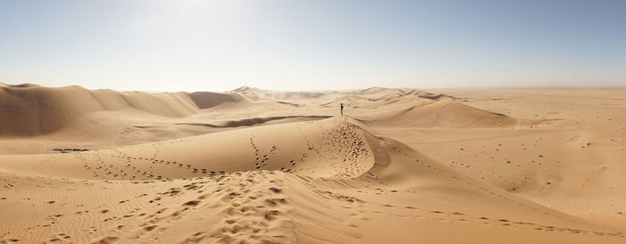 Scenic view of desert against clear sky