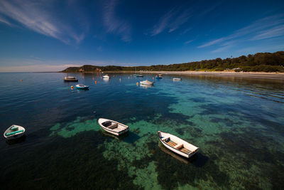 High angle view of boats moored on sea against sky