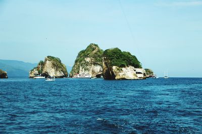 Scenic view of sea against clear blue sky