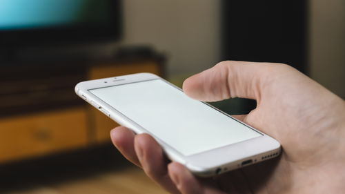 Close-up of man using mobile phone