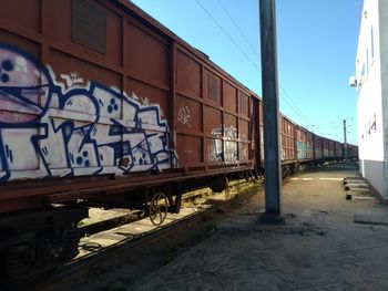 Train on railroad track against sky