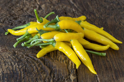 High angle view of yellow chili peppers on table