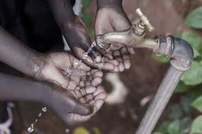 Close-up of hand holding water