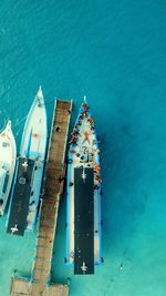 Directly above view of boats moored in sea