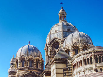 Low angle view of building against blue sky