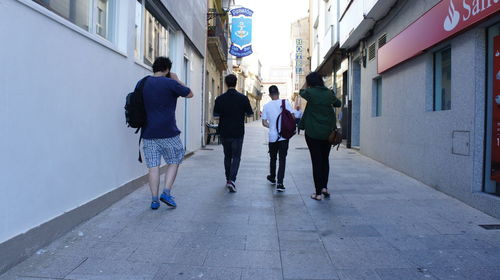 People walking on street in city