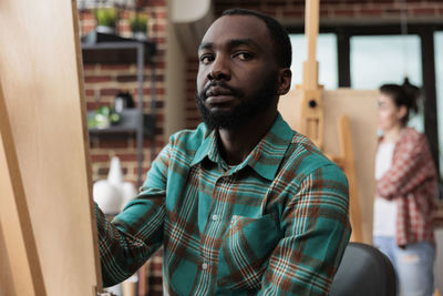 Portrait of young man looking away