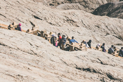 High angle view of group of hikers in volcanic land