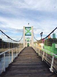 Footbridge against sky