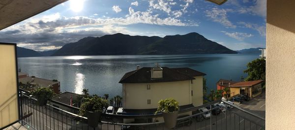 Panoramic view of sea and buildings against sky