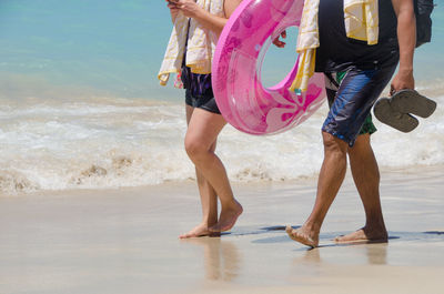 Low section of people on beach