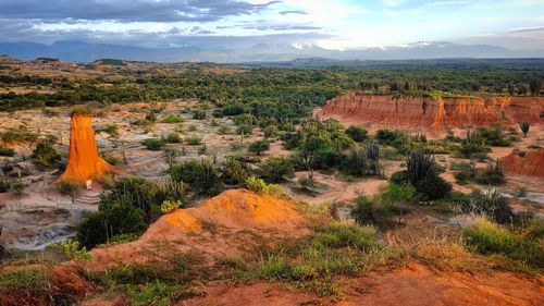 Scenic view of landscape against cloudy sky