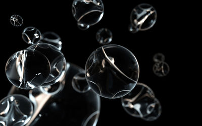Close-up of bubbles against black background