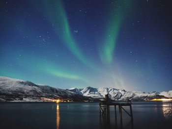 Scenic view of landscape against sky at night