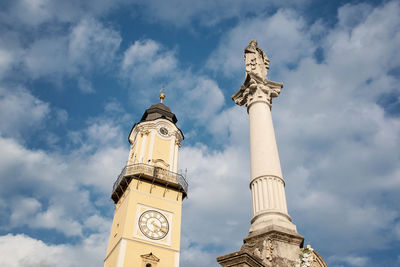 Low angle view of clock tower against sky