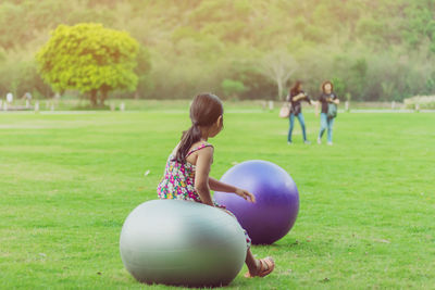 Children playing with ball on field