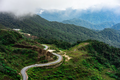 High angle view of road amidst mountains against sky