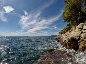 Scenic view of sea against blue sky