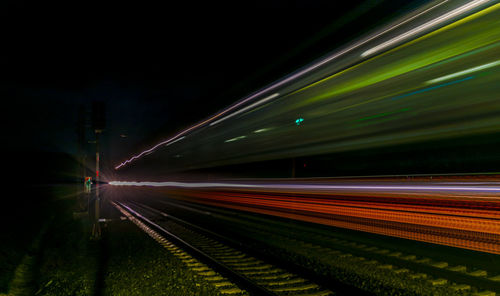 Blurred motion of light trails on road at night