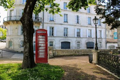 Street by building in city