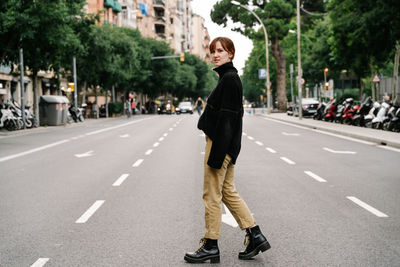 Urban portrait of a young woman in the middle of the city