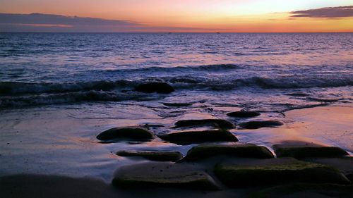 Scenic view of sea at sunset