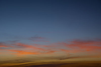 Low angle view of dramatic sky during sunset