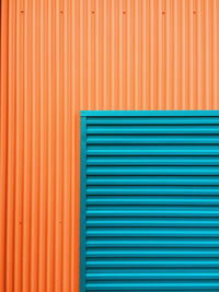 Full frame shot of blue and orange shutter