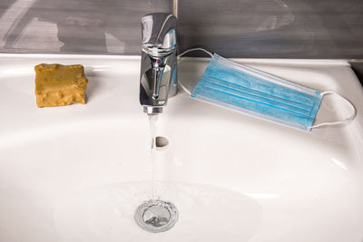 High angle view of faucet in bathroom