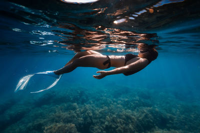 Man swimming in sea