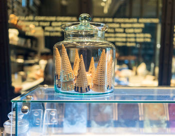 Close-up of ice cream cones on display cabinet