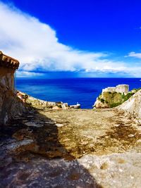 Scenic view of sea against cloudy sky