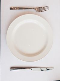 Close-up of white plate on table