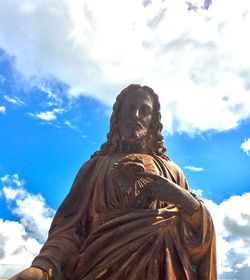 Low angle view of statue against sky